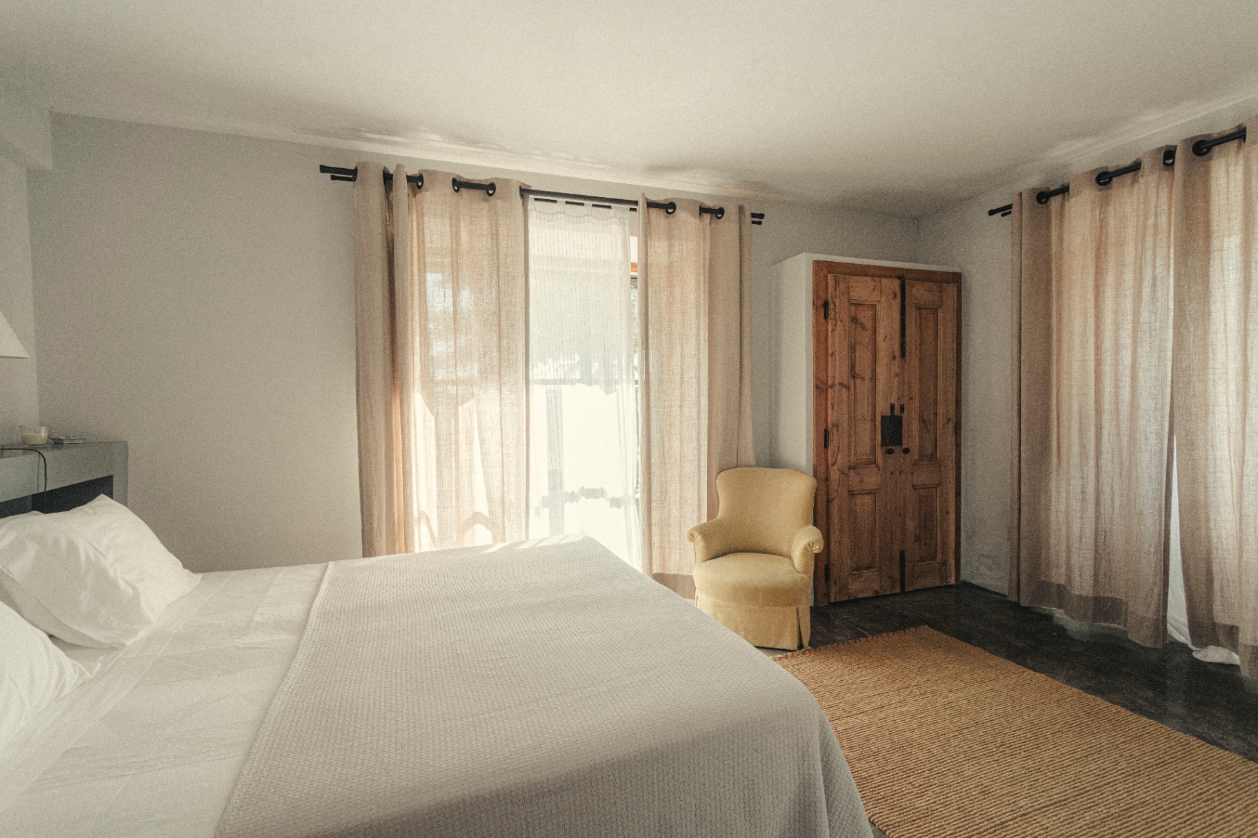 Bedroom with linen curtains